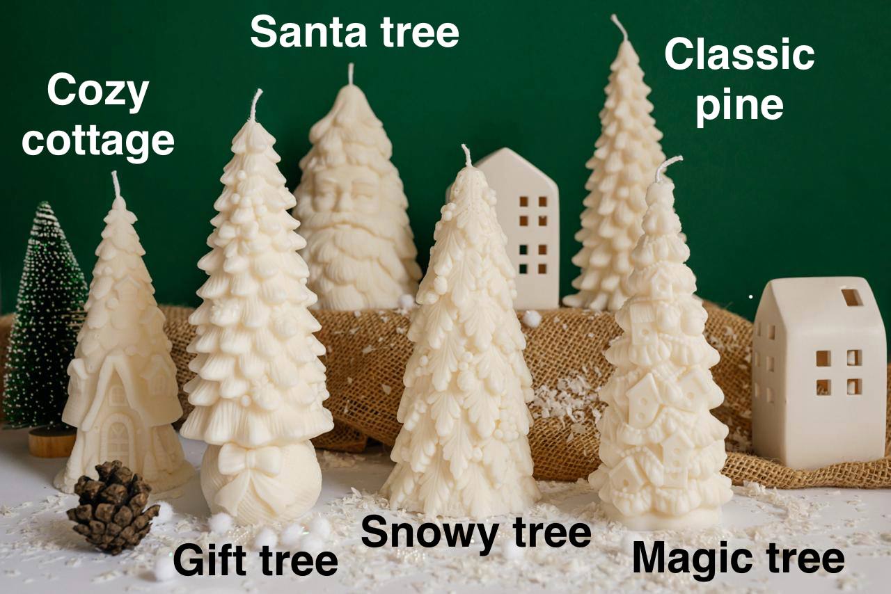 Complete set of 6 creamy white soy wax Christmas candles arranged together, creating a snowy village scene with Santa, cottage, and textured trees.
