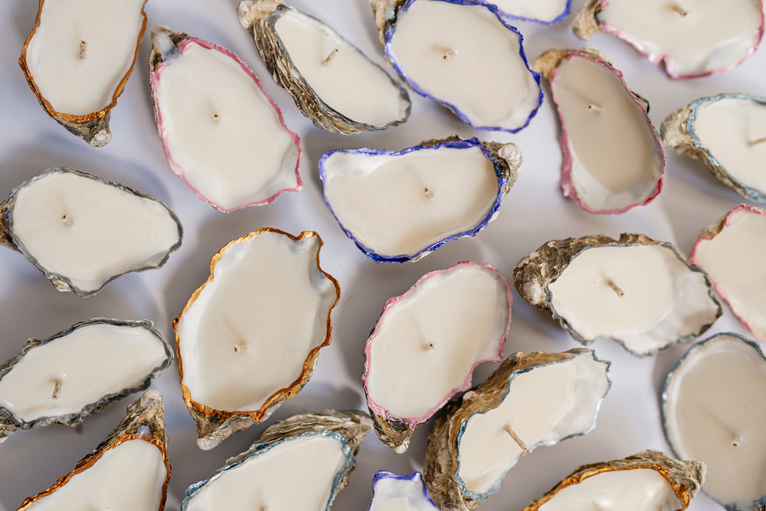 Oyster shell candle wedding favors styled for a coastal wedding table