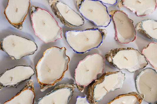 Oyster shell candle wedding favors styled for a coastal wedding table
