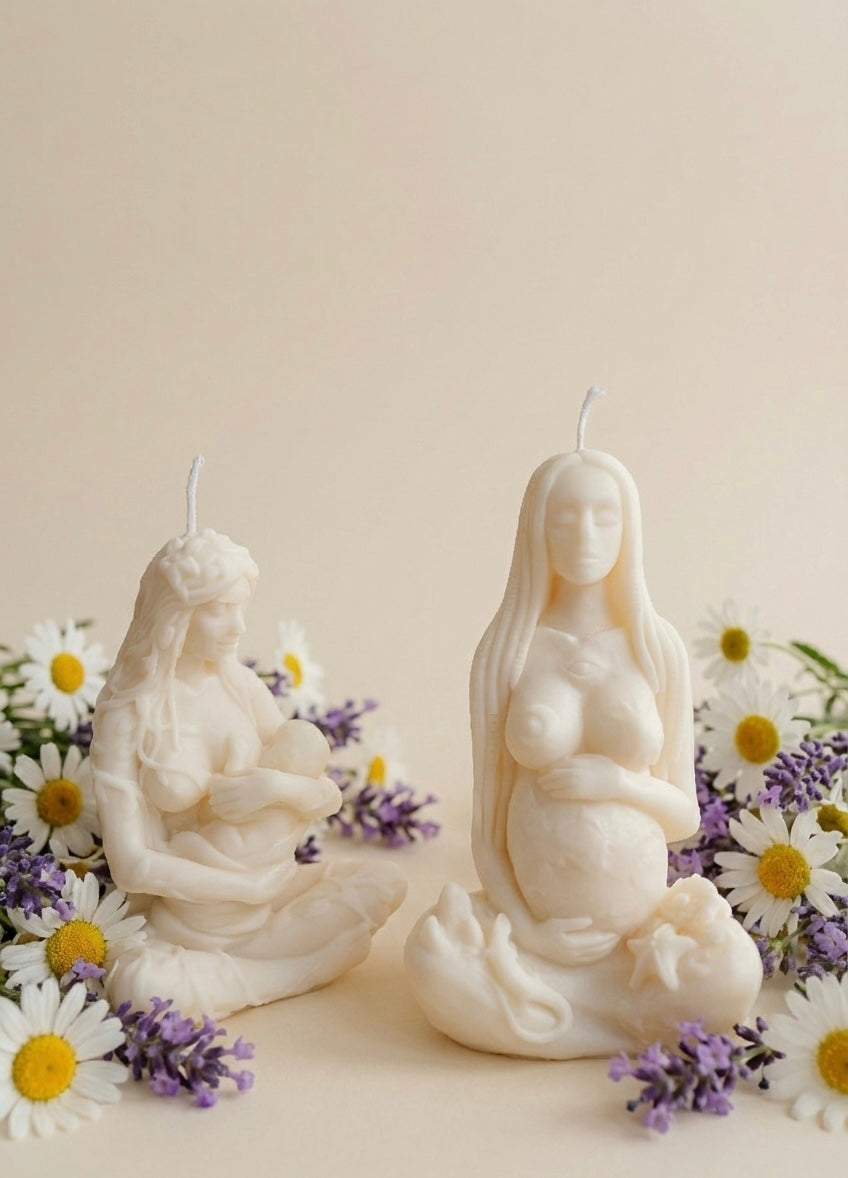 Set of two ivory candles featuring Gaia Mother Earth and a breastfeeding mother figurine