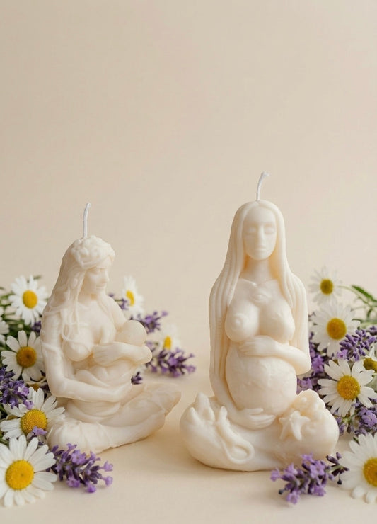 Set of two ivory candles featuring Gaia Mother Earth and a breastfeeding mother figurine